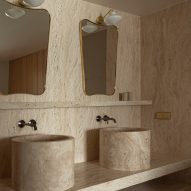 Twin travertine marble sinks and mirrors Puro hotel Warsaw
