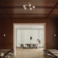 Wood-panelled walls and ceilings in room with large doorway
