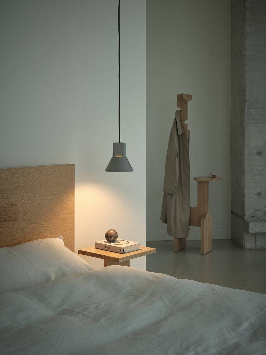 The Vent Pendant hanging in a bedroom