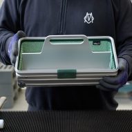 A person handling a toolbox