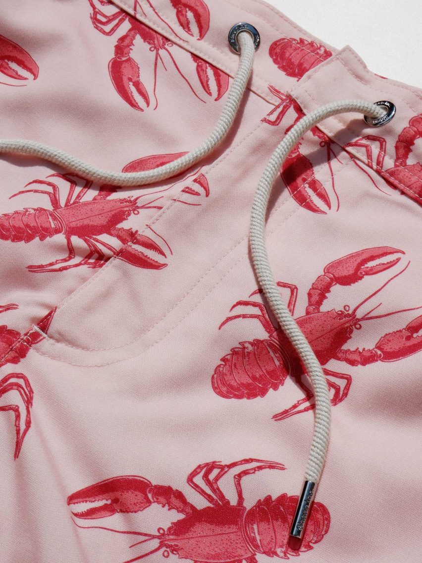 Close-up of swim shorts with lobster print