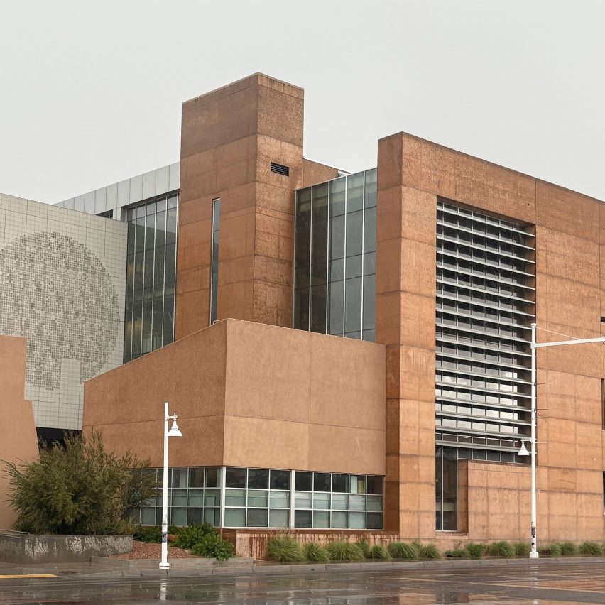 a photograph of a university building in tones of brown and grey