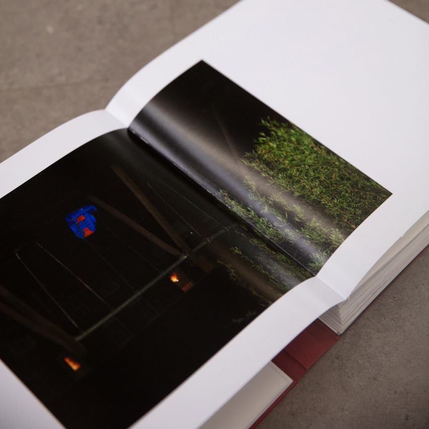 a photograph of an open book displaying a dark image against a white page