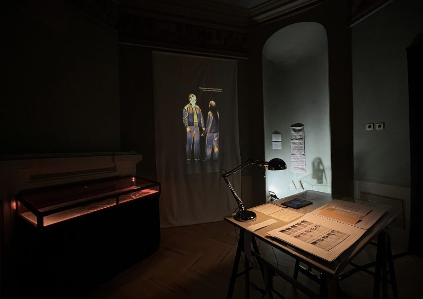 a photograph of an installation showing two people interacting