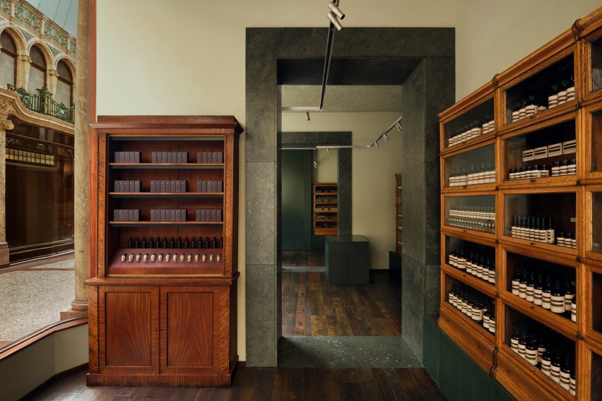 Wooden shelves and green doorway in skincare store