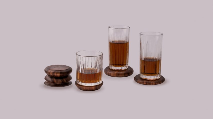 a photograph of three glasses with brown liquid in them