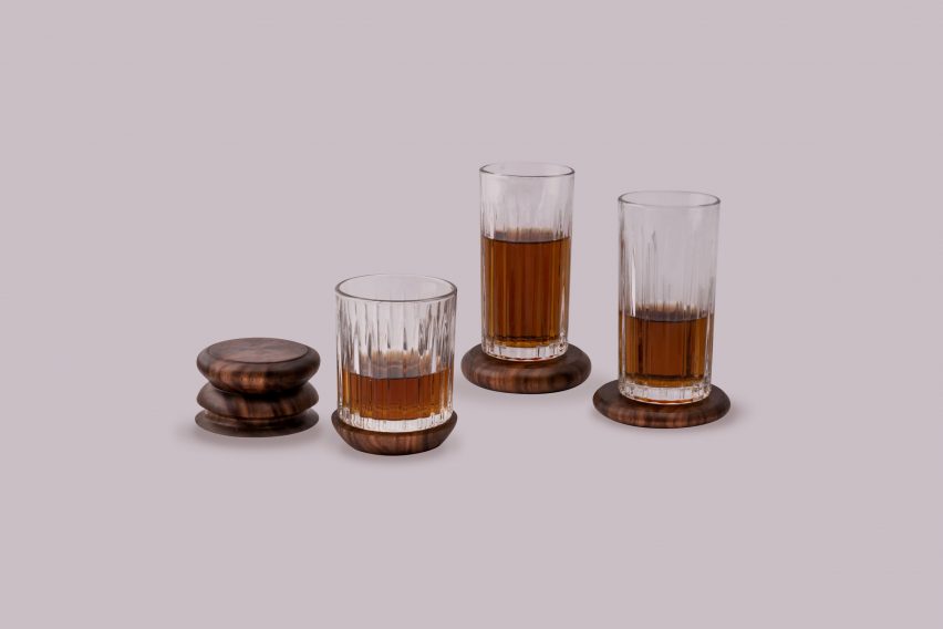 a photograph of three glasses with brown liquid in them