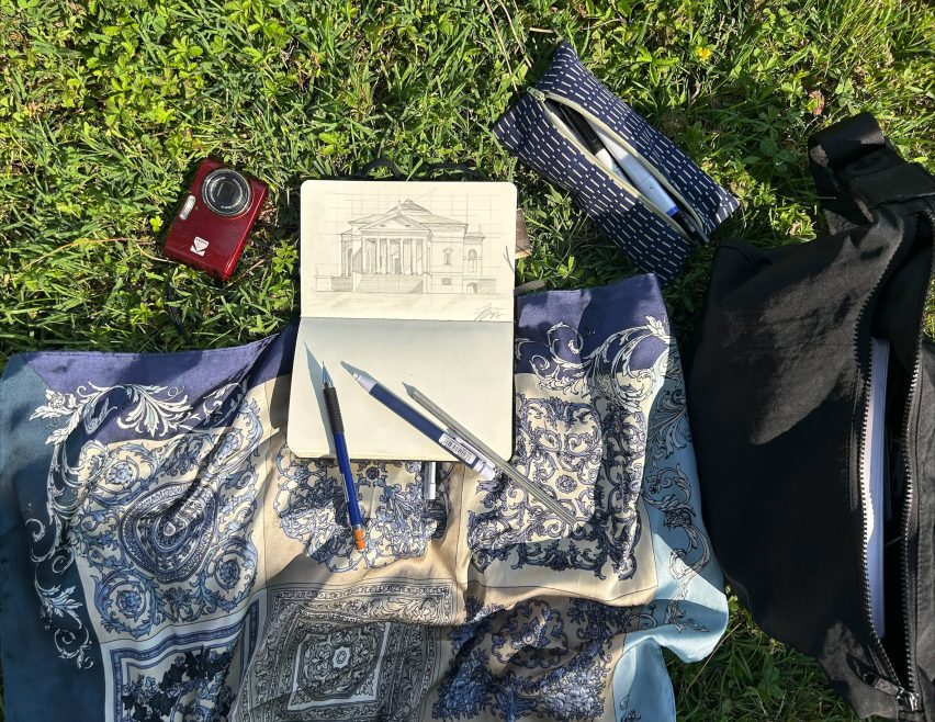 a photograph of a notebook on a blanket on grass