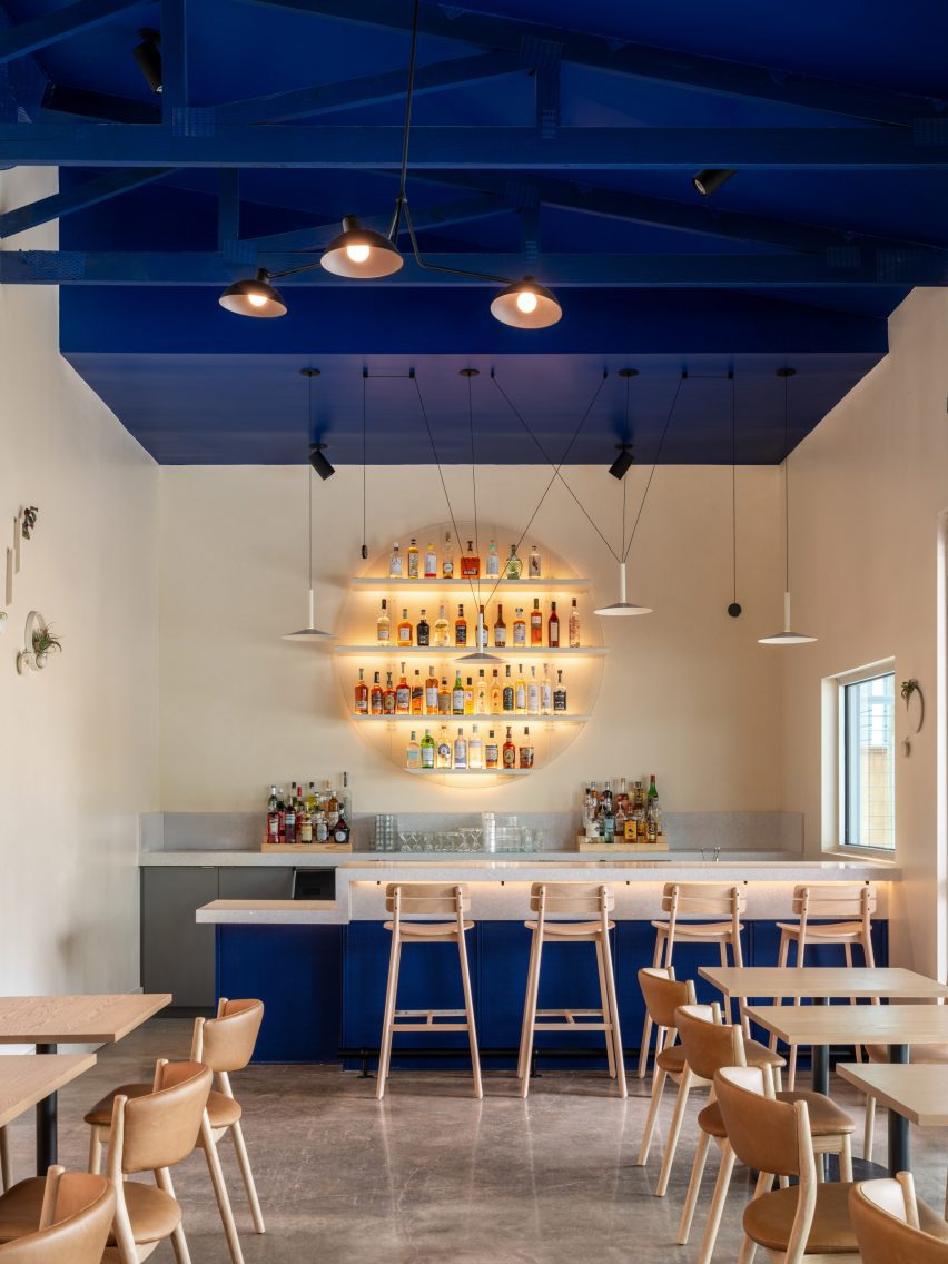 Navy ceilinged bar and lounge space
