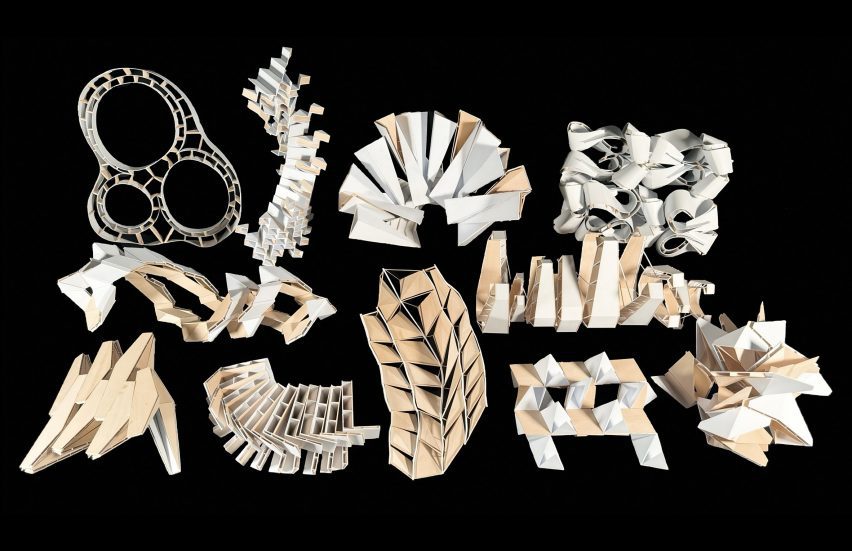 A photograph of multiple cardboard models in abstract shapes