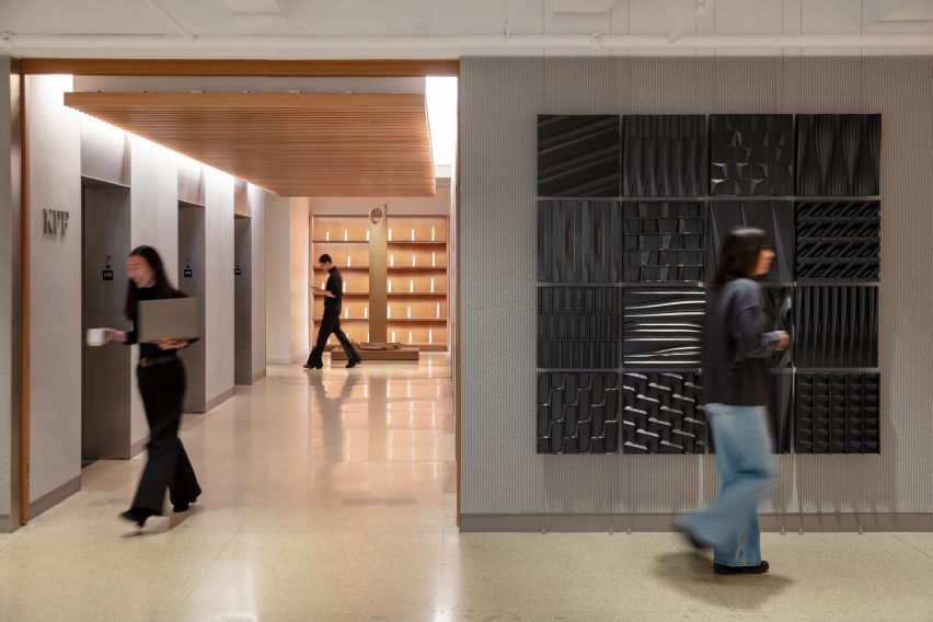 View of textured wall tiles and an elevator bank
