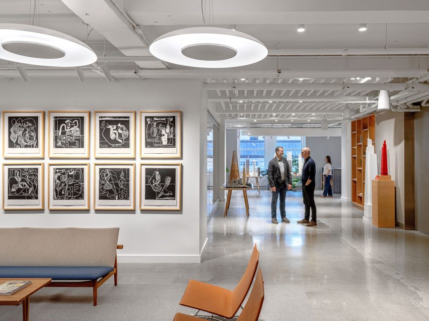 Office reception and corridor with concrete floor and white walls