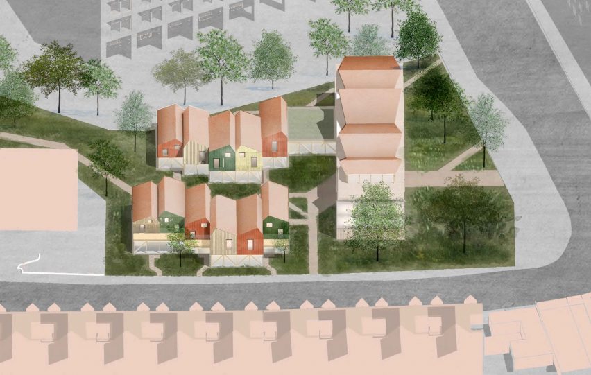a diagram from above of buildings in tones of pink and surrounded by green