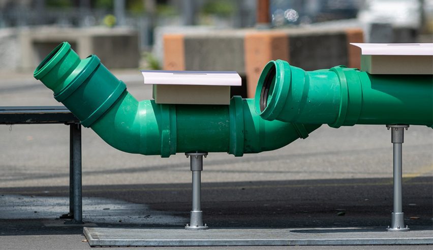 a photograph of drain pipes in green tones