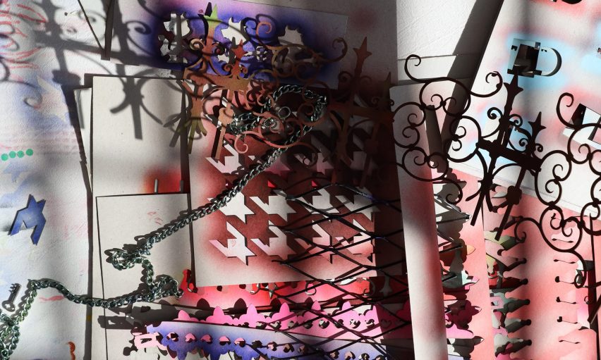 a photograph of a paper collage in tones of red, purple, black and white