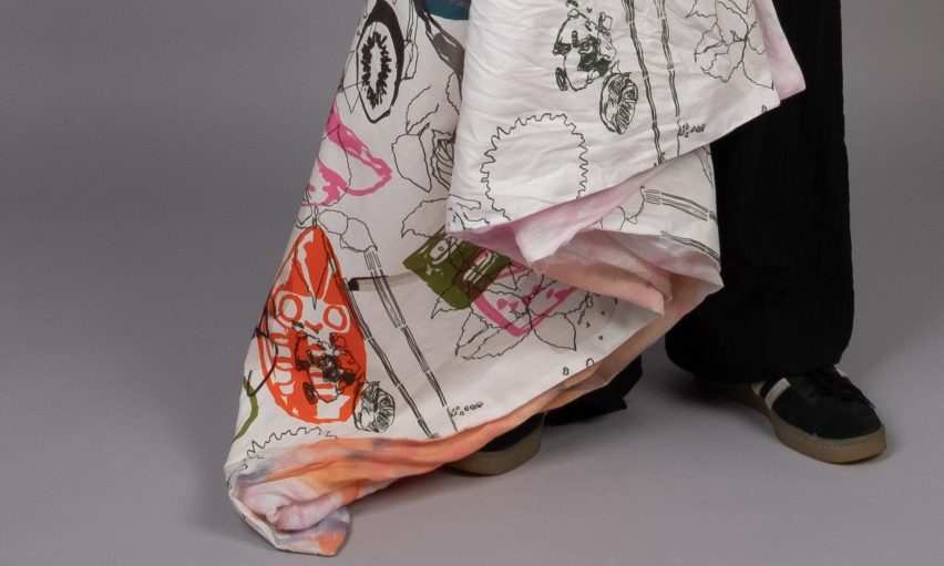 a photograph of a person's legs beside a sheet of fabric with illustrations on it