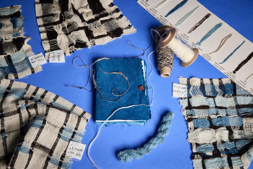 a photograph of fabrics laid against a blue backdrop 