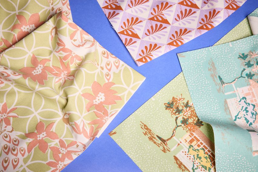 a photograph of printed fabrics against a blue backdrop