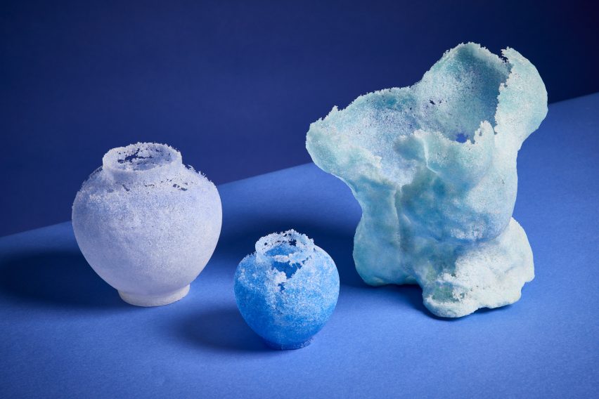 a photograph of glassware projects on a blue surface