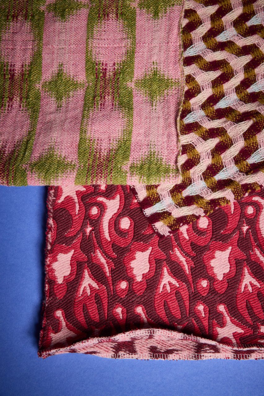 a photograph of pink printed fabrics against a blue backdrop