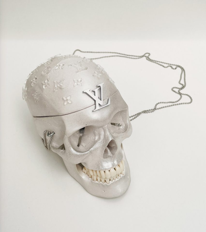 a photograph of a skull painted in silver
