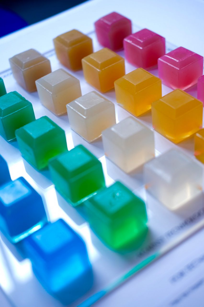 a photograph of jelly cubes in tones of blue, green, orange, clear and pink