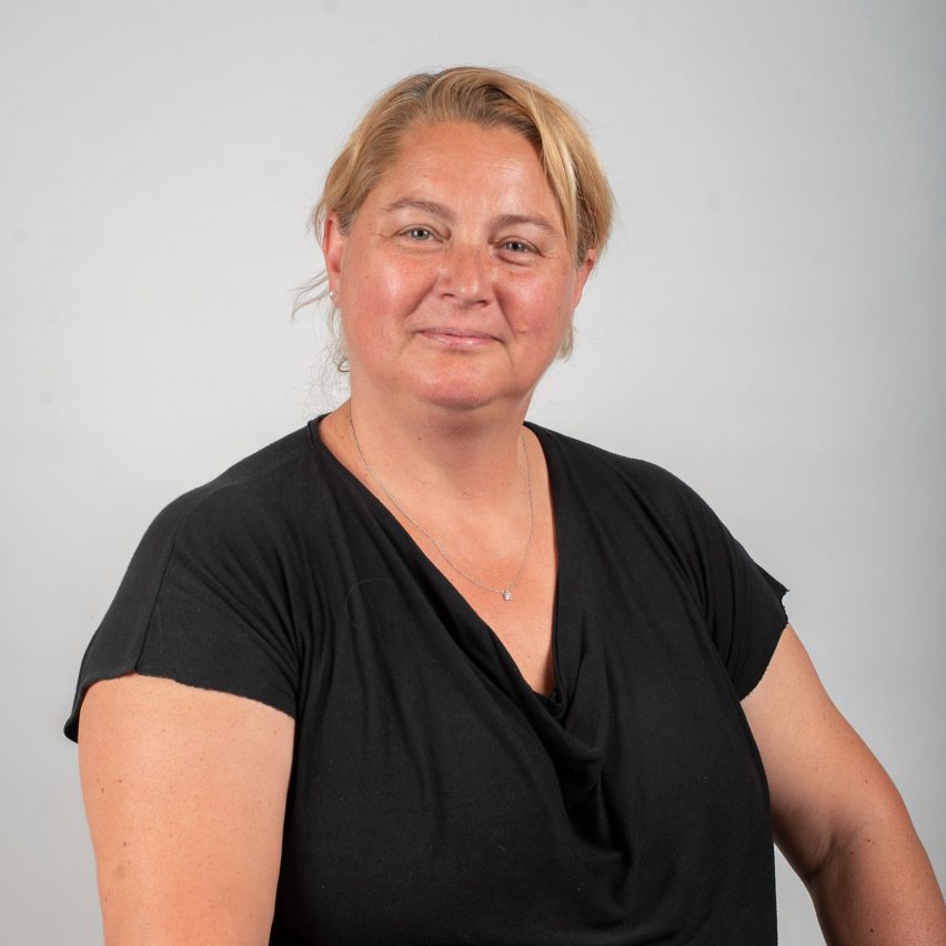 a photograph of a person facing the camera in black clothing