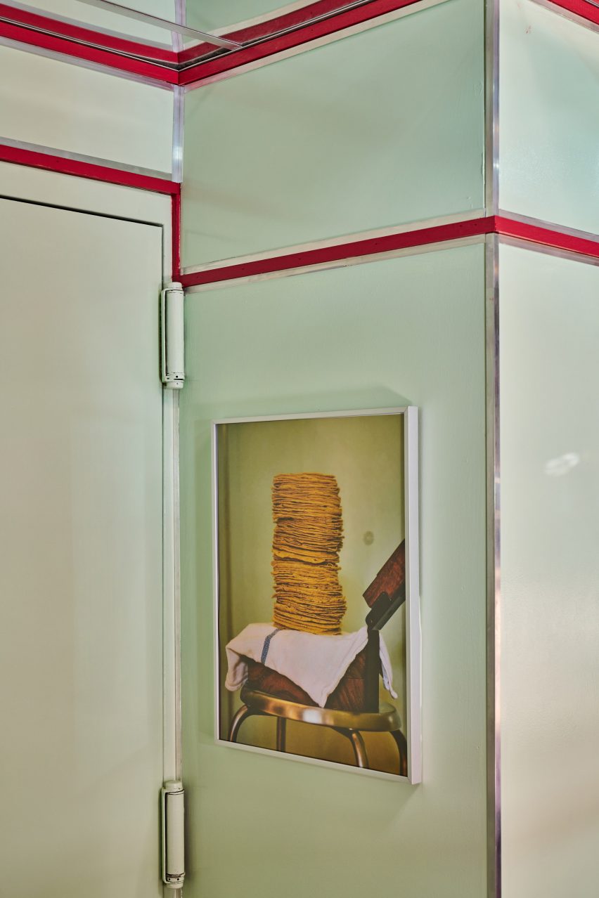 Mint green walls, red outlines and original artwork