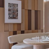 Wood wall panel detailing behind marble table