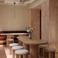 Table and chairs with shell limestone wall feature