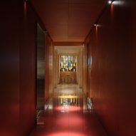Corridor lined with red panels