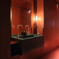 Bathroom with red panels lining the walls and floor