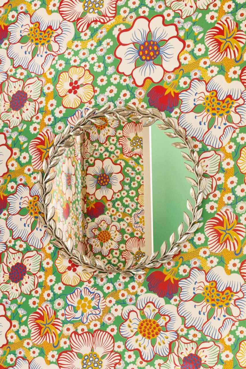 Mirror on floral wall