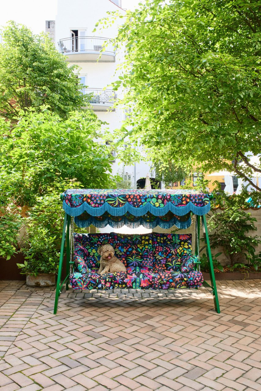 Dog in floral-patterned hammock