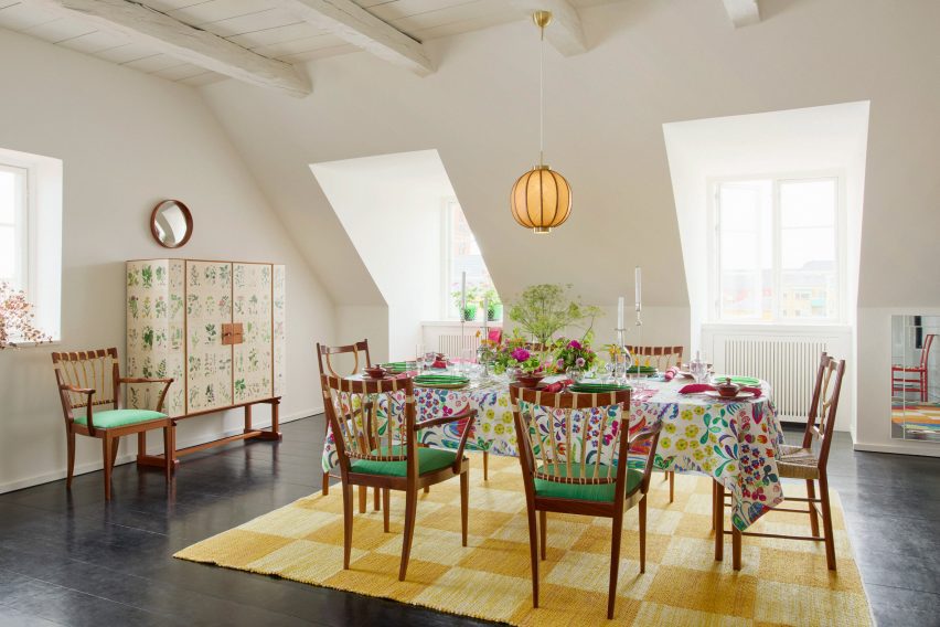 Green chairs on yellow rug