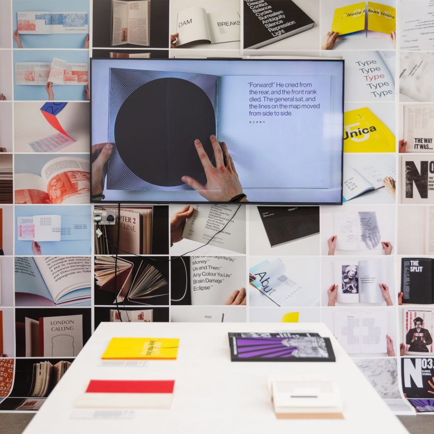 a photograph of a screen and prints on a table