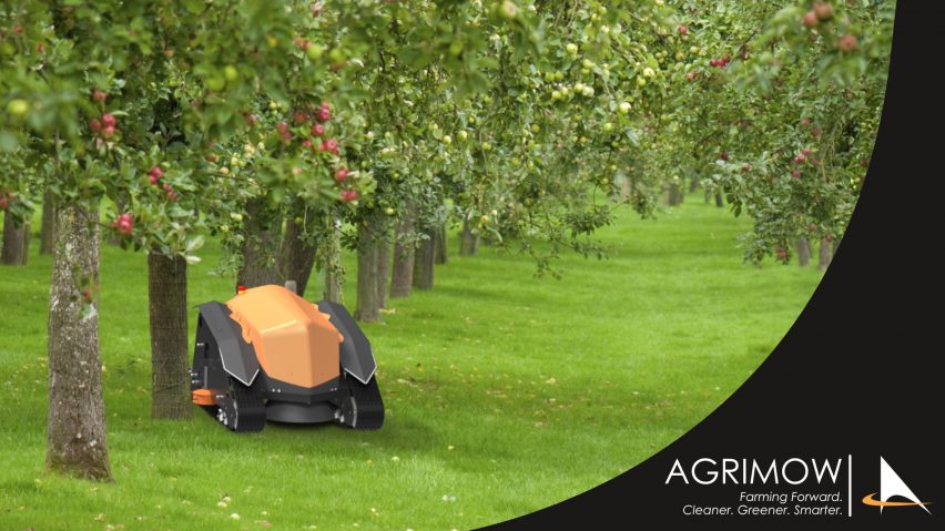a photograph of an orange robot with wheels in a green field