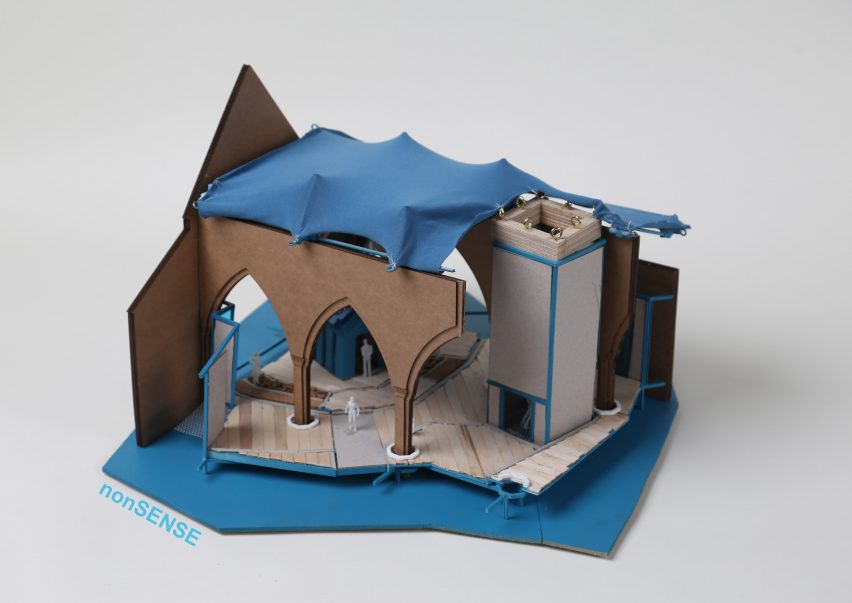 a photograph of an architectural model in tones of brown and blue