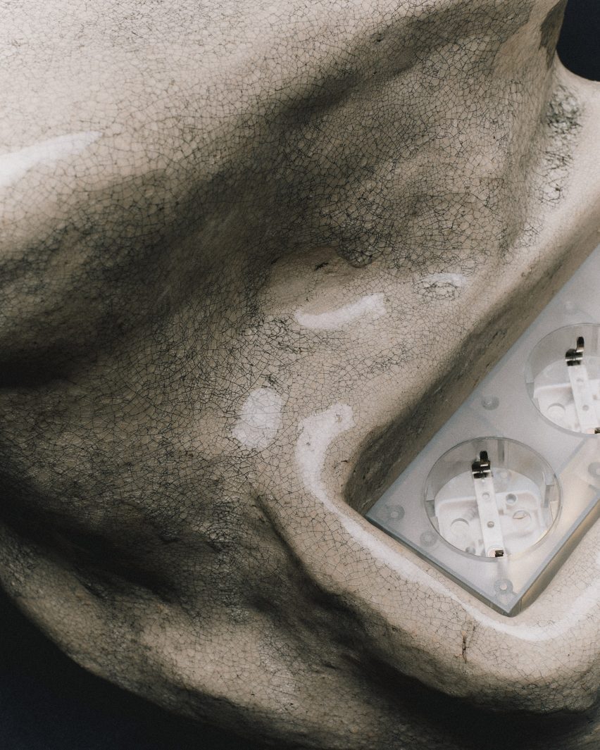 Close-up of plugs in Ceramic Power Gem extension cord by Pedestal
