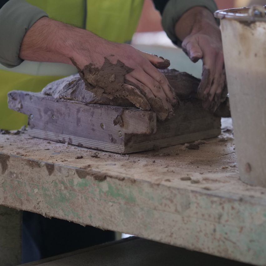 a person making a brick