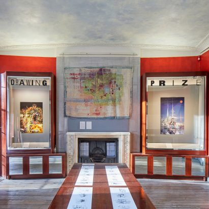 Gallery space with architectural drawings are hanging up