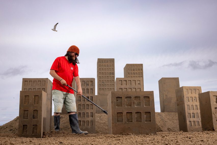 Man building sand towers