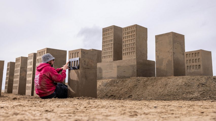 Artist building sand castles
