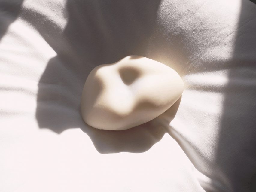 a photograph of a sex toy in tones of white
