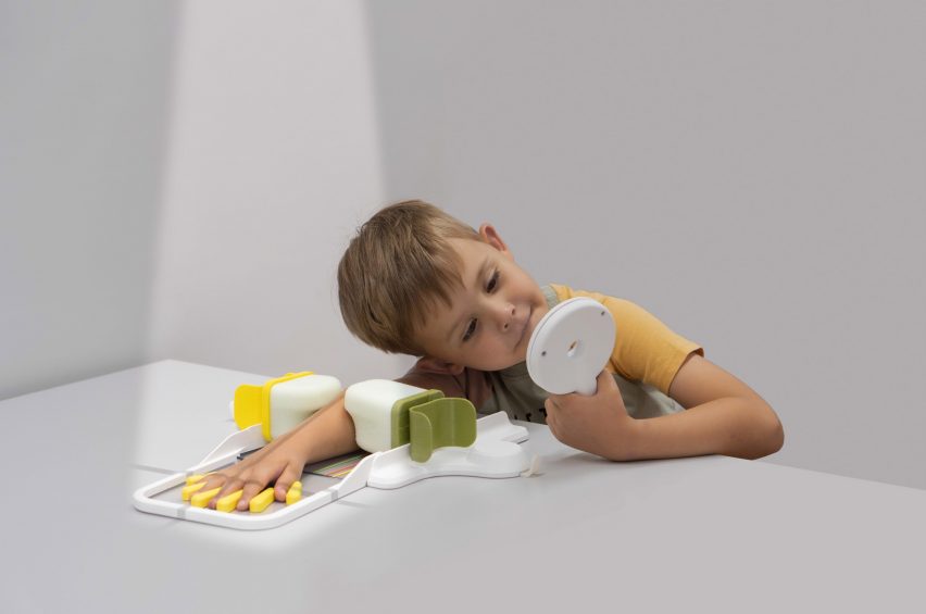 a photograph of a child holding objects