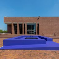 Massive speakers and swimming pool in front of mid-century library feature at Exhibit Columbus