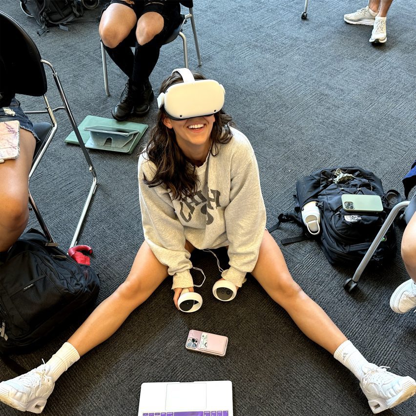 a photograph of a person using a VR headset