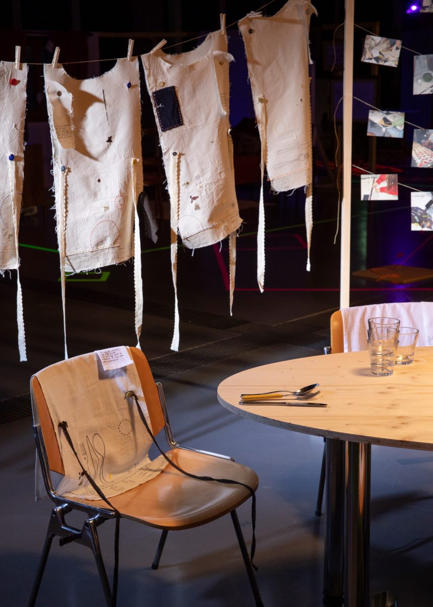 a photograph of a table with a washing line behind it
