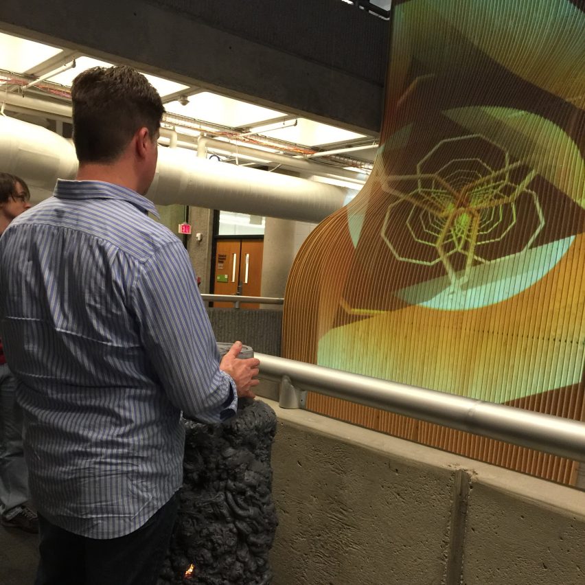 a photograph of a person with an interactive artwork