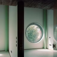 A House with an Inverted Roof by Fala Atelier